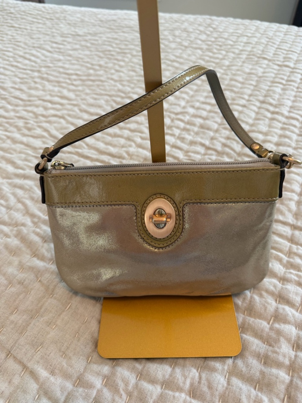 Coach Peyton Metallic large clutch/wristlet with hangtag. 8.25x5.5 EUC